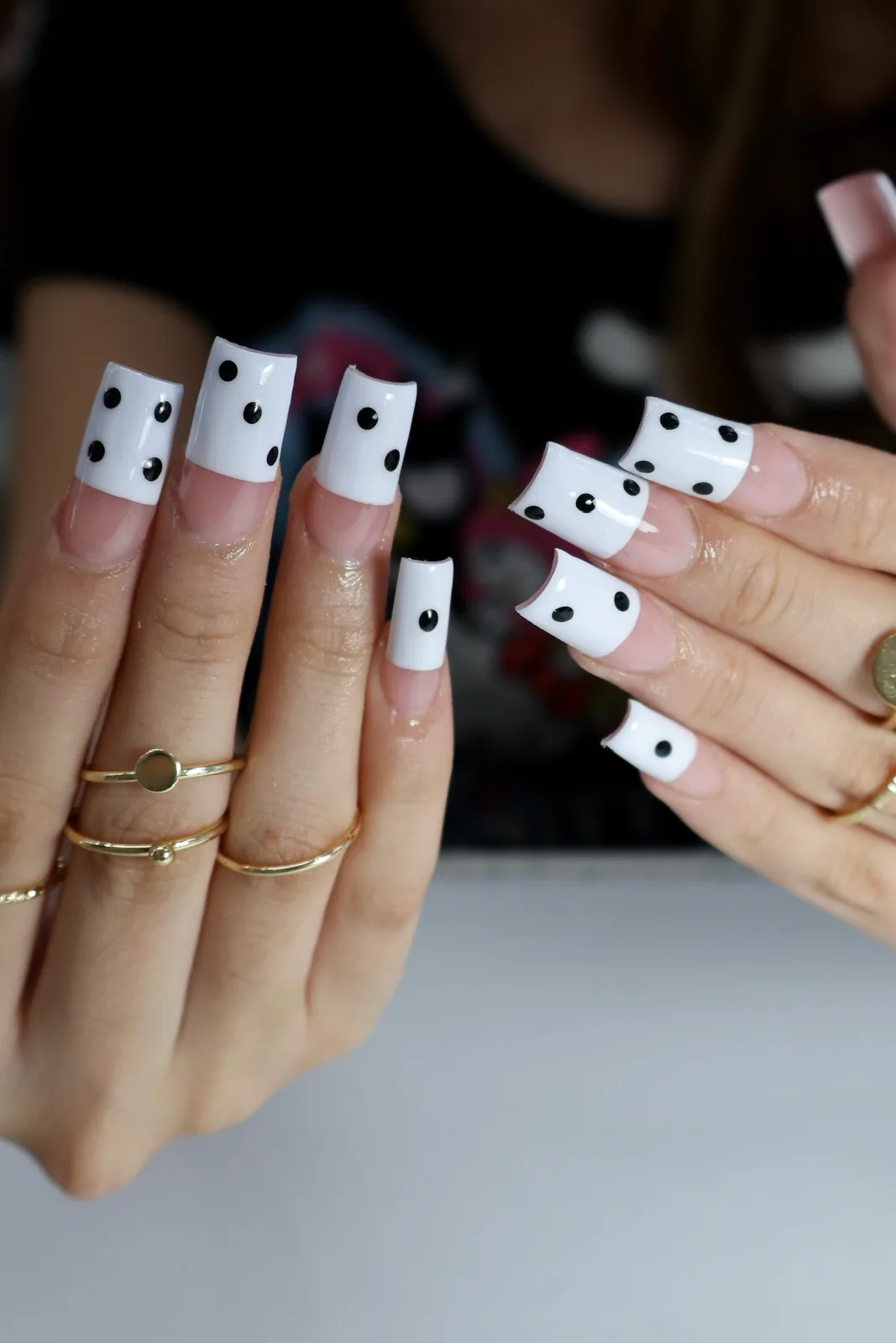 Long white French square nails with playful black polka dots