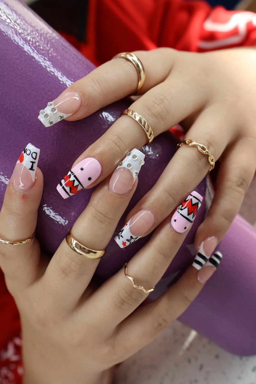 Playful square nails with hand-painted cartoon character and striped nail art