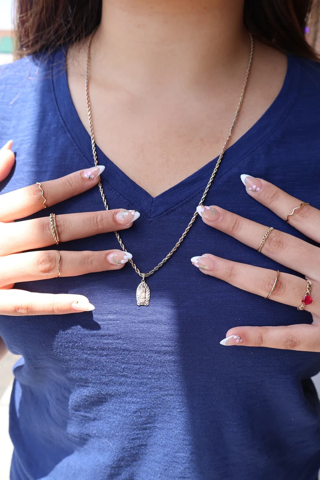 Client wearing a classic white French manicure on natural nails