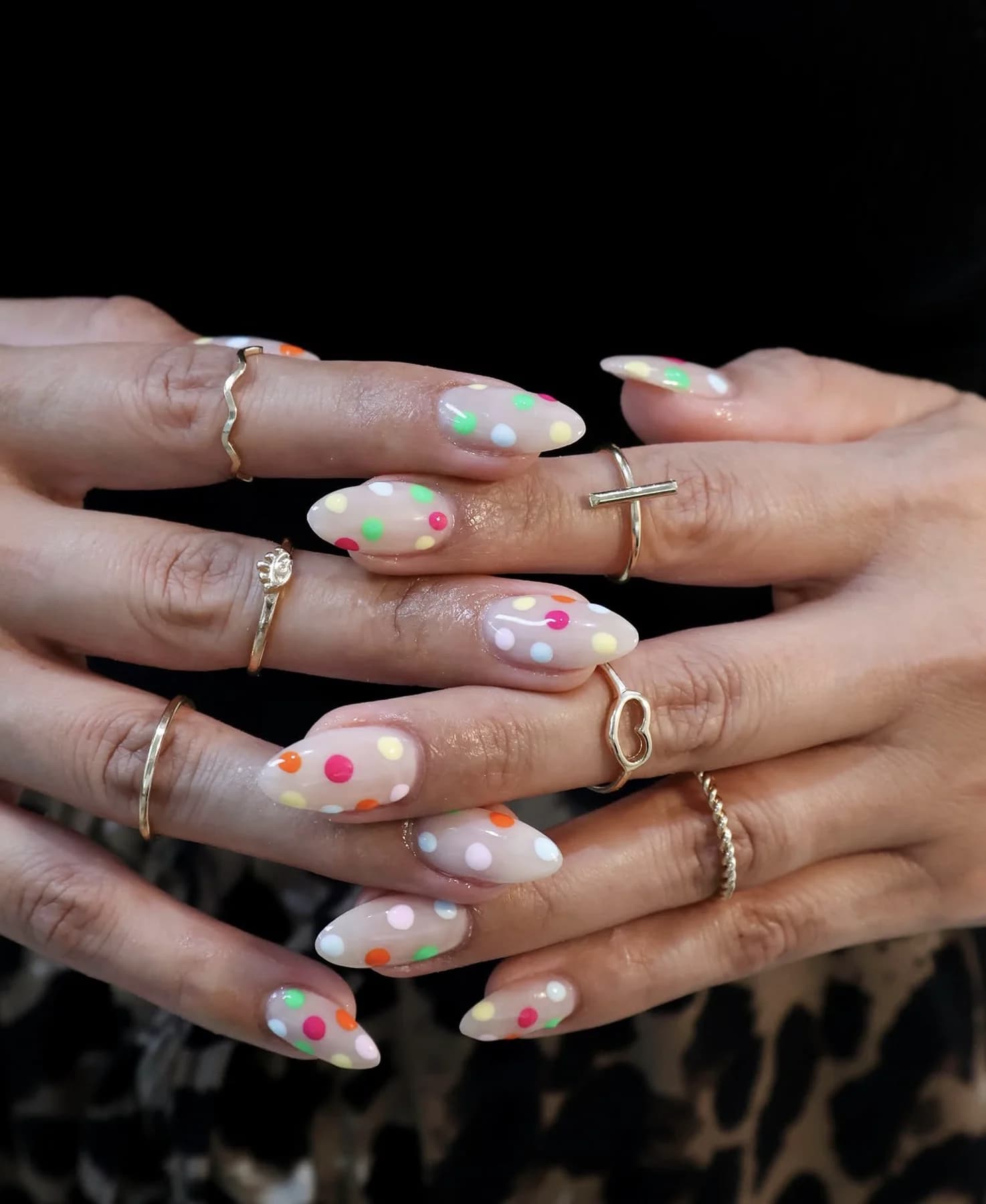 Milky almond nails with pastel neon polka dots
