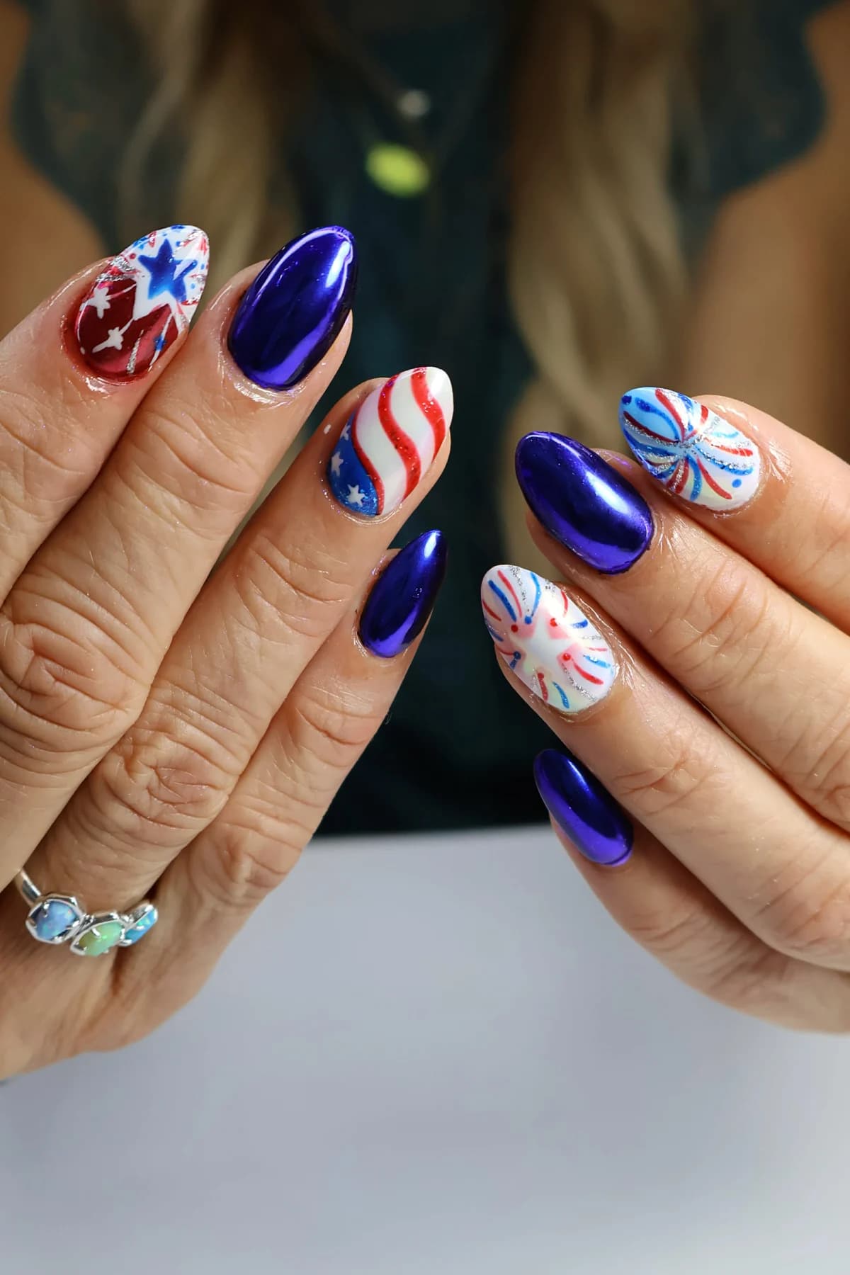 Red, white, and blue chrome nails with stars and firework nail art