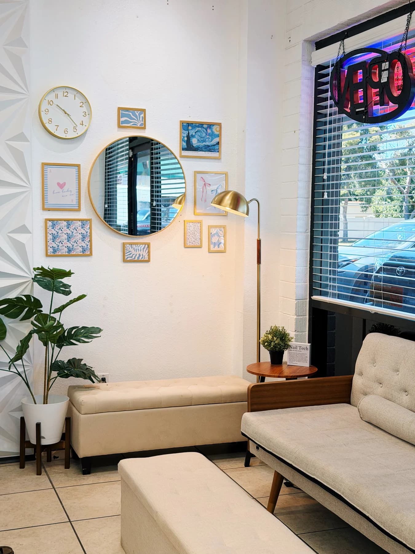 Bright waiting lounge with cream seating inside King & Queen Nails & Spa